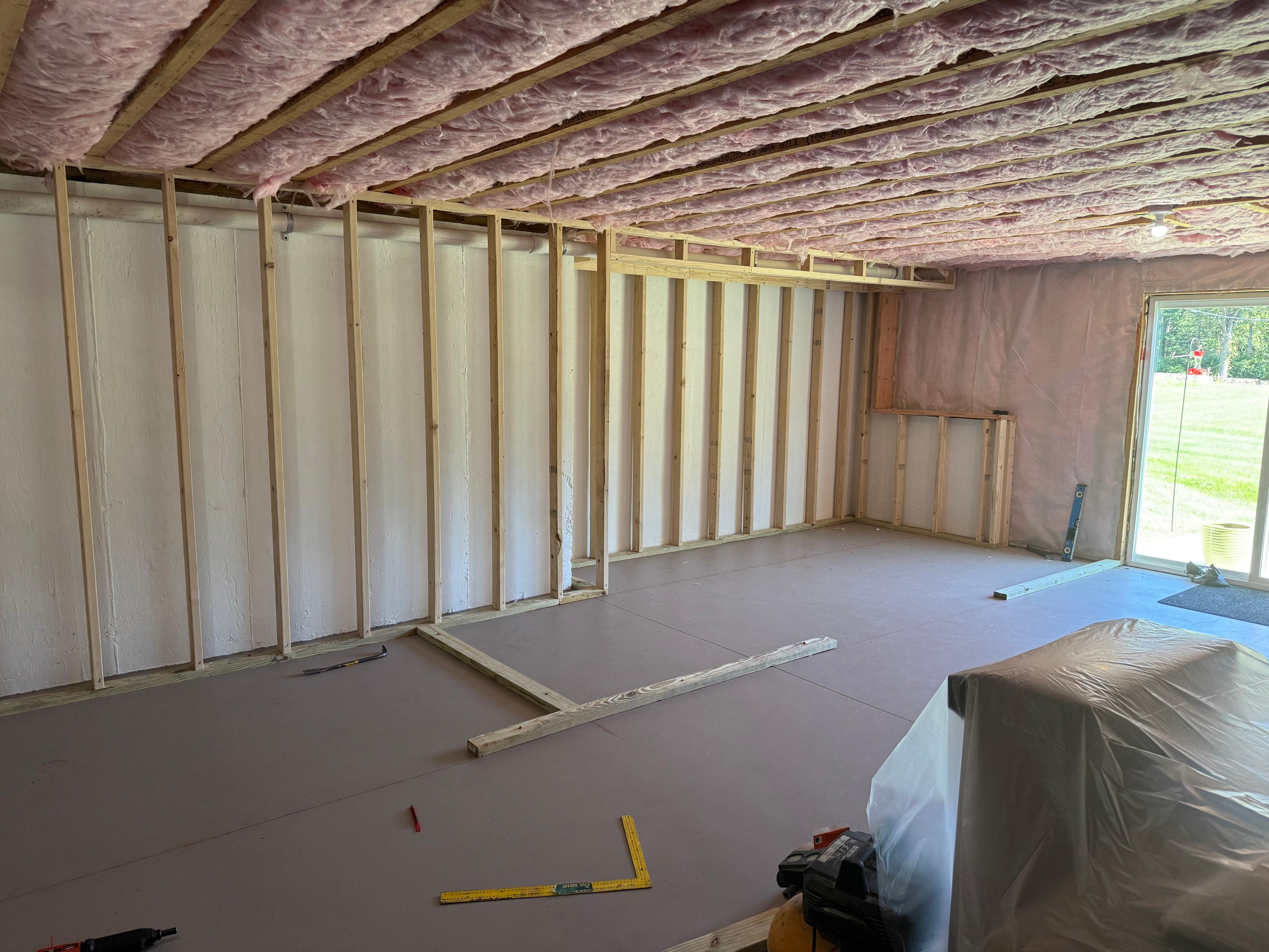 Interior construction with insulation and framing visible